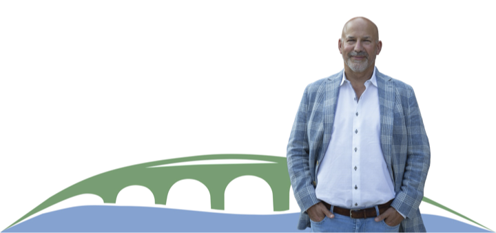 Chris Moser, candidate for Regional Councillor, in front of an illustrated Waterloo Region bridge and river